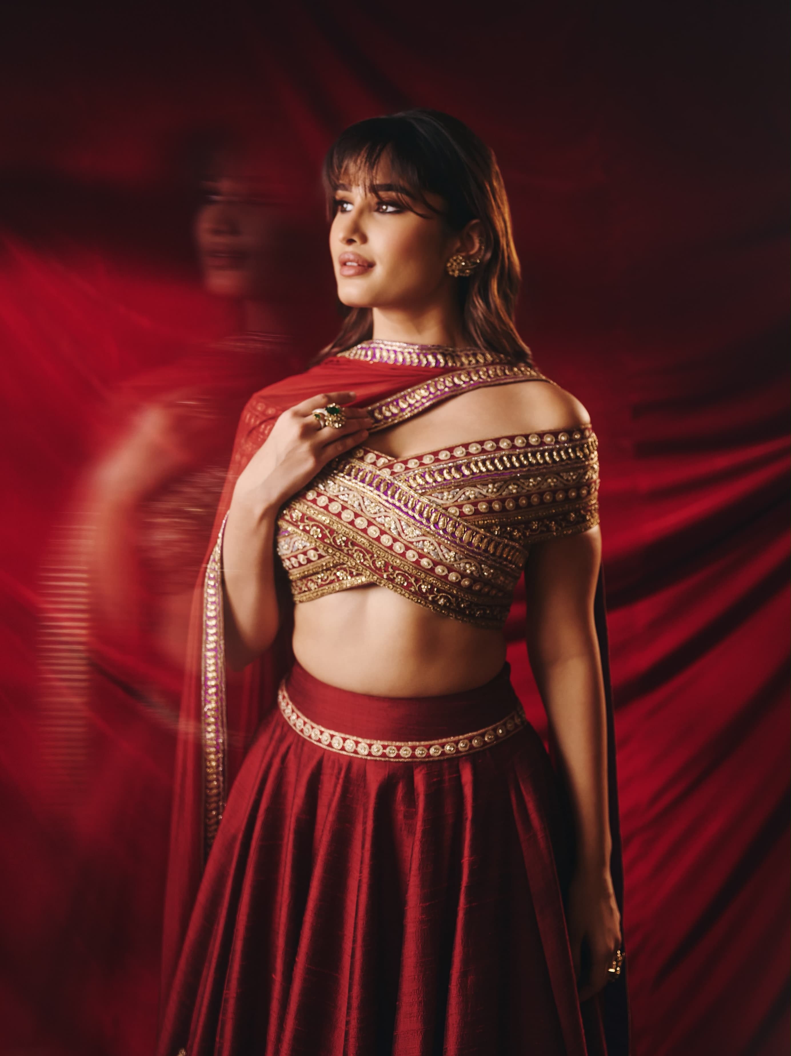 Burnished Crimson, Kashmiri Zari, and a Young Star in the Frame